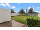 Fenced backyard features brick pavers and a lush green lawn, perfect for outdoor relaxation and activities at 2258 Sedge Grass Way, Orlando, FL 32824