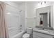 Bathroom featuring a shower-tub combination and granite vanity at 2258 Sedge Grass Way, Orlando, FL 32824