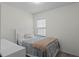 Bright bedroom with a single bed and window at 2258 Sedge Grass Way, Orlando, FL 32824