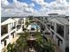 Community featuring an aerial view of pool, landscaping, and townhome buildings at 2305 Edgewater Dr # 1701, Orlando, FL 32804