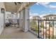 Balcony featuring large columns, a lounge chair, and a view of the courtyard at 2305 Edgewater Dr # 1701, Orlando, FL 32804