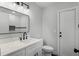 Bathroom features modern vanity, a black framed mirror, and subway tile at 2335 Montano St, Deltona, FL 32738