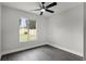 Bedroom with ceiling fan and view of the fenced backyard at 2335 Montano St, Deltona, FL 32738