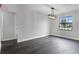 Dining room with modern light fixture and a large window providing natural light at 2335 Montano St, Deltona, FL 32738