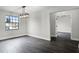 Dining room featuring dark hardwood floors, modern light fixture, and plenty of natural light at 2335 Montano St, Deltona, FL 32738