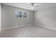 Bedroom with tile floors, ceiling fan, and a large window at 250 Douglas Dr, Eustis, FL 32726