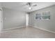 Bedroom with tile floors, ceiling fan, and a window for natural light at 250 Douglas Dr, Eustis, FL 32726