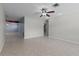 Bright open-concept living room with tile floors, a ceiling fan, and neutral walls at 250 Douglas Dr, Eustis, FL 32726