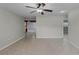 Spacious living room with tile flooring and views into other rooms at 250 Douglas Dr, Eustis, FL 32726