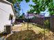 Fenced backyard featuring patio with canopy, chairs, and an air conditioning condenser at 2600 Musselwhite Ave, Orlando, FL 32804