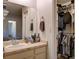 Bathroom featuring a vanity, mirror, and a walk-in closet at 2600 Musselwhite Ave, Orlando, FL 32804