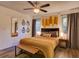 Inviting bedroom featuring decorative elements, soft lighting, and a bench at 2600 Musselwhite Ave, Orlando, FL 32804