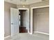 This bedroom features neutral colors and multiple doors, providing easy access at 2628 Caribe Dr, The Villages, FL 32162