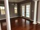 Formal dining area with hardwood floors and French doors to the outdoor lanai at 2628 Caribe Dr, The Villages, FL 32162