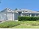 Well-maintained single Gathering home featuring an attached garage and pristine landscaping in a sunny neighborhood at 2628 Caribe Dr, The Villages, FL 32162