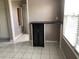 Eat-in kitchen area with dark countertops and a cabinet with see-through doors at 2628 Caribe Dr, The Villages, FL 32162