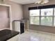 Bright kitchen features white cabinets, black countertops, and a spacious island perfect for meal prep at 2628 Caribe Dr, The Villages, FL 32162