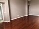 Bright living room featuring hardwood floors, fresh paint, and a neutral color palette at 2628 Caribe Dr, The Villages, FL 32162
