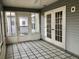 Enclosed patio with tiled floor provides an outdoor living space at 2628 Caribe Dr, The Villages, FL 32162