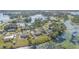 Serene residential neighborhood nestled along a picturesque lake, showcasing waterfront homes and lush landscapes at 2662 Hibiscus Ct, Deltona, FL 32738