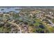 Lakeside community featuring lush landscaping and a waterfront view at 2662 Hibiscus Ct, Deltona, FL 32738