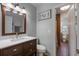 Bathroom featuring a dark wood vanity, bright counter, and modern fixtures at 2662 Hibiscus Ct, Deltona, FL 32738