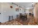 Dining area featuring stone tile floors, modern lighting, and a view to an office at 2662 Hibiscus Ct, Deltona, FL 32738