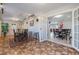 Dining area with stone tile floors, barstool seating, and a view to the outdoor foliage at 2662 Hibiscus Ct, Deltona, FL 32738