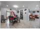 Open dining area features neutral walls, tile floors, and seamless flow to the living room at 2662 Hibiscus Ct, Deltona, FL 32738