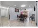 Bright dining room featuring tile floors, neutral walls, and modern lighting fixtures at 2662 Hibiscus Ct, Deltona, FL 32738