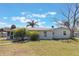 A single-story home with mature landscaping, pathway and a well-maintained lawn at 2662 Hibiscus Ct, Deltona, FL 32738