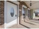 Close-up of the elegant front door, showcasing the brick facade and overhead lighting at 2662 Hibiscus Ct, Deltona, FL 32738