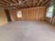 Spacious unfinished room with exposed beams, wood framing and concrete floor, waiting for final touches at 30117 Misty Pines Rd, Mount Dora, FL 32757