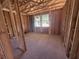 An unfinished Bedroom with a window offering natural light and backyard view at 30120 Misty Pines Rd, Mount Dora, FL 32757