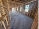 Bright Living Room view with large windows, offering potential for a cozy and inviting space at 30120 Misty Pines Rd, Mount Dora, FL 32757