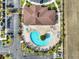 Aerial view of a community pool with a unique design and plenty of lounge chairs at 3204 Gold Ln, Kissimmee, FL 34747