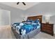 Bedroom features wooden headboard bed with side tables and light-colored wood flooring at 3204 Gold Ln, Kissimmee, FL 34747