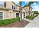 Attractive townhome exterior featuring well-maintained landscaping, a sidewalk, and inviting curb appeal at 3204 Gold Ln, Kissimmee, FL 34747