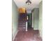 Entryway featuring stairs, wooden floors, and green walls at 3593 Raintree Cir, Lakeland, FL 33803