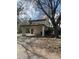 A two-story home exterior showing carport and mature trees at 3593 Raintree Cir, Lakeland, FL 33803