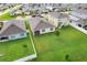 This aerial view highlights the expansive backyard and neighborhood homes at 3871 Brant Pl, Leesburg, FL 34748