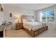 Inviting main bedroom featuring a comfortable bed, neutral decor, and plenty of natural light at 3871 Brant Pl, Leesburg, FL 34748