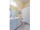 Bright bathroom featuring a white vanity, tile flooring, and a shower/tub combo at 4268 Ethan Ln, Orlando, FL 32814