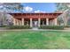 Inviting community pavilion with a pergola roof surrounded by lush green landscaping at 4268 Ethan Ln, Orlando, FL 32814