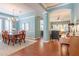 Elegant dining room showcasing hardwood floors, chandelier, and seamless flow to living spaces at 4268 Ethan Ln, Orlando, FL 32814