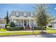 Charming two-story home showcasing a covered front porch, brick steps, and lovely lawn at 4268 Ethan Ln, Orlando, FL 32814