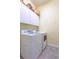 Laundry room with white cabinets and side-by-side washer and dryer at 4268 Ethan Ln, Orlando, FL 32814