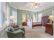 Elegant main bedroom featuring tray ceilings, shutters and an ensuite bathroom at 4268 Ethan Ln, Orlando, FL 32814