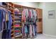 Spacious walk-in closet with custom built-in storage for clothing, shoes, and accessories at 4268 Ethan Ln, Orlando, FL 32814