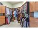 Spacious walk-in closet with custom built-in storage for clothing, shoes, and accessories at 4268 Ethan Ln, Orlando, FL 32814